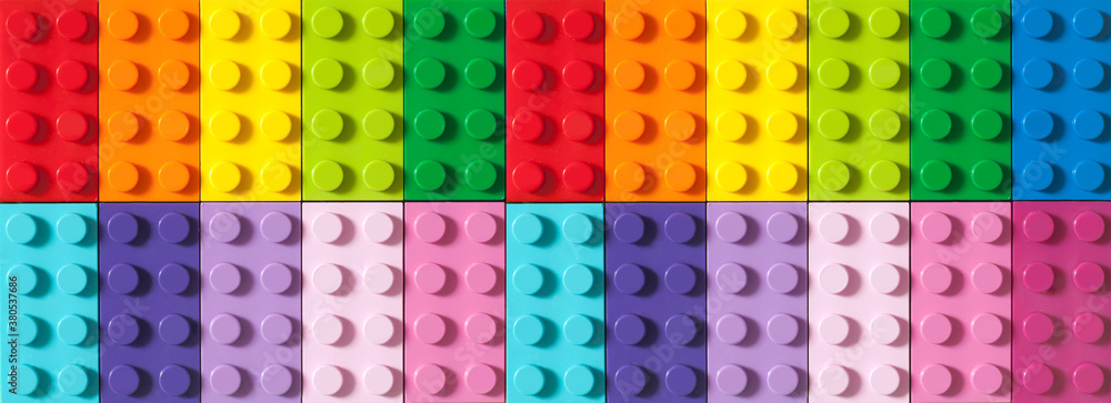 Naklejka premium Many toy blocks in different colors making up one large square shape in top view. Toys and games. Leisure and recreation.