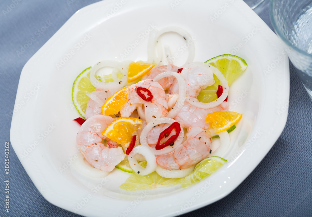 Refreshing prawns ceviche with lime, orange, onion and spices