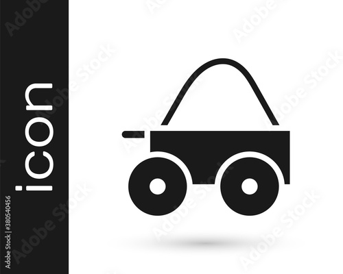 Black Wooden four-wheel cart with hay icon isolated on white background. Vector.