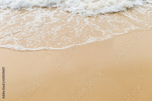 Clean sea water wave on clear fine sand beach, nature concept background, outdoor day light