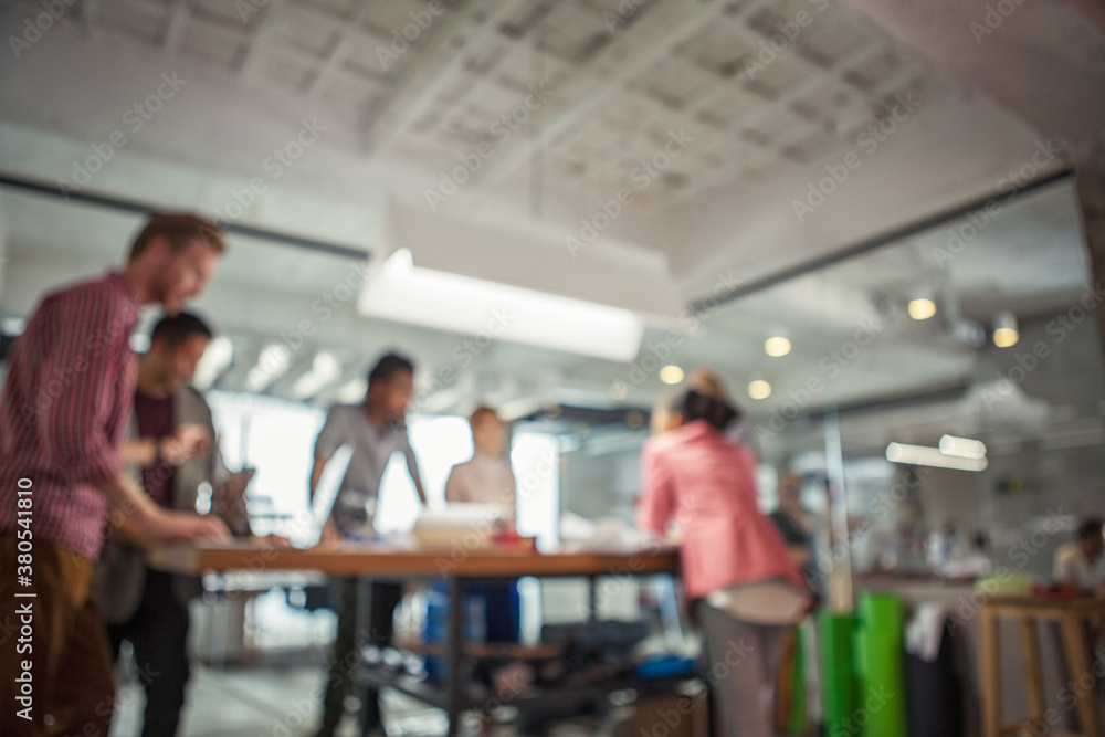 Blurred Shot of a Business Team Working Together Blurred Shot of a Business Team Working Together