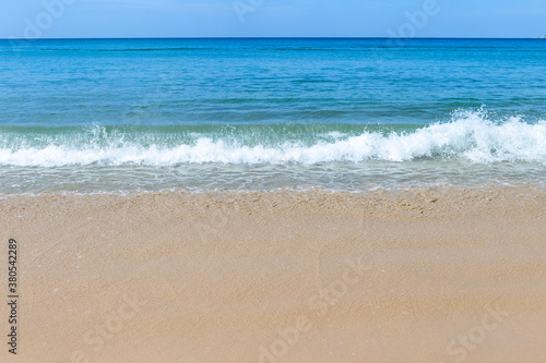 White wave on beautiful clean sand beach, paradise island in south of Thailand, summer outdoor day light, holiday and vacation destination in Asia