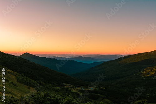 Fototapeta Naklejka Na Ścianę i Meble -  Picturesque landscapes of the Carpathians, before sunrise there is a light fog, sunrise in Montenegro.