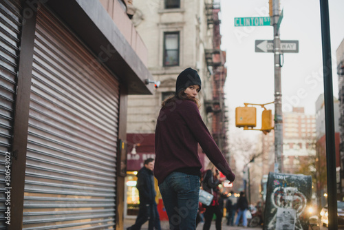 Wallpaper Mural Young woman walking in the city Torontodigital.ca