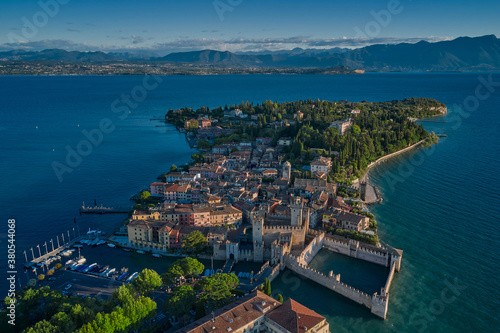 Aerial view on Sirmione sul Garda. Italy, Lombardy. Rocca Scaligera Castle in Sirmione. View by Drone early in the morning