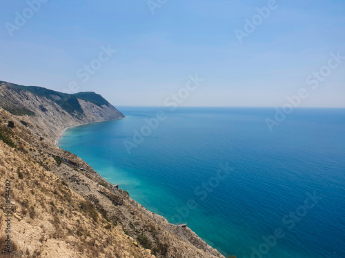 Landscape of rocky sea coast and azure water.