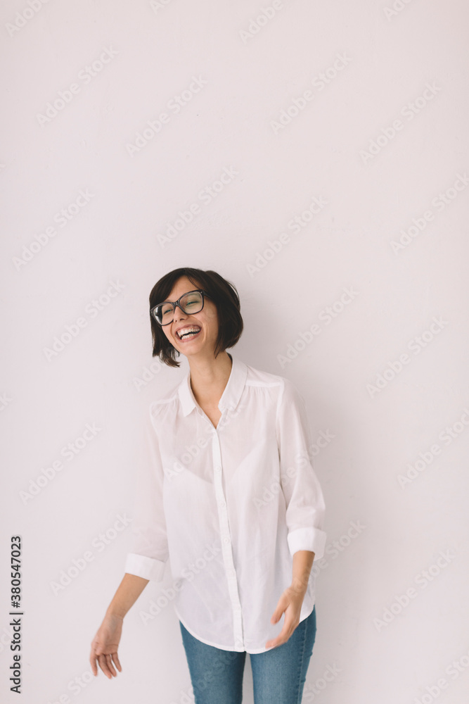 Happy young woman over white wall Happy young woman over white wall