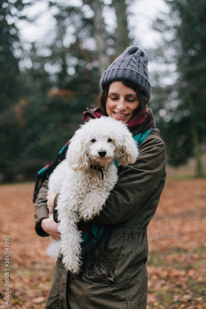 Beautiful happy woman having a good time with her dog outdoors Beautiful happy woman having a good time with her dog outdoors