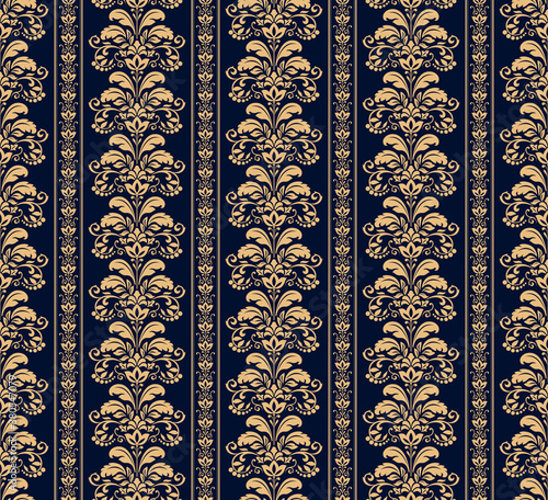 Wallpaper in the style of Baroque. Seamless vector background. Gold and dark blue floral ornament. Graphic pattern for fabric, wallpaper, packaging. Ornate Damask flower ornament