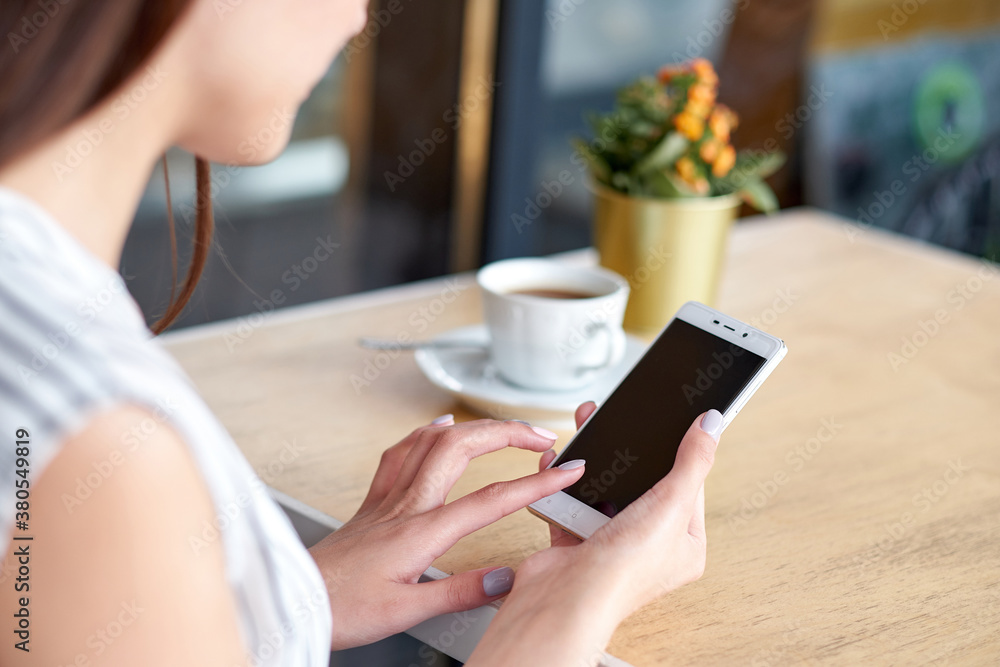 Business woman hands with smart phone and cup of coffee. For Graphic display montage. Business woman hands with smart phone and cup of coffee. For Graphic display montage.
