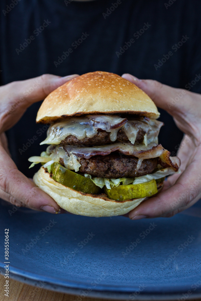 Hands Holding Double Hamburger Hands Holding Double Hamburger