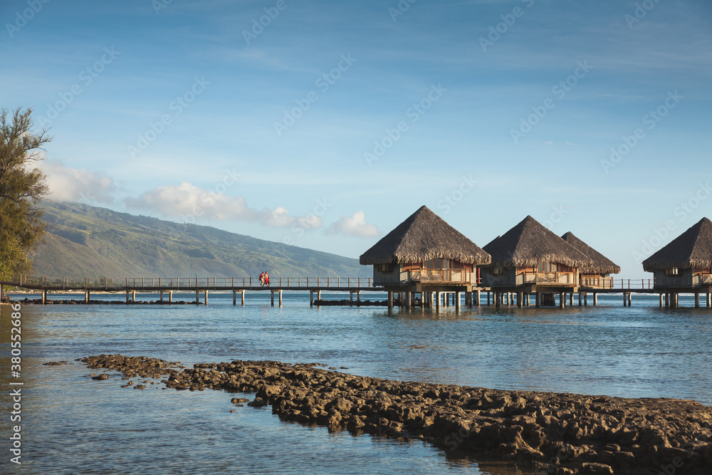 Over water bungalows in the shallow water of the lagoon in Tahiti. Over water bungalows in the shallow water of the lagoon in Tahiti.
