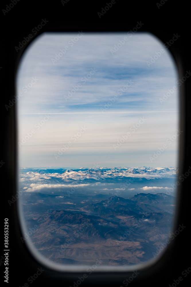 View of the Rockies through an airplane window View of the Rockies through an airplane window