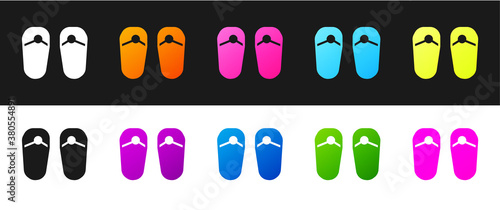 Set Flip flops icon isolated on black and white background. Beach slippers sign. Vector.