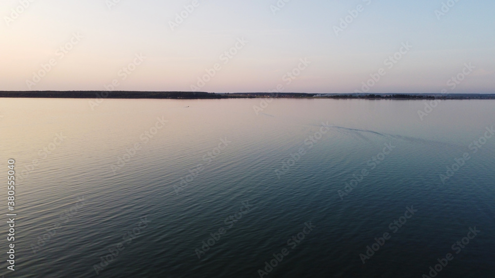 Top view of a calm large forest lake