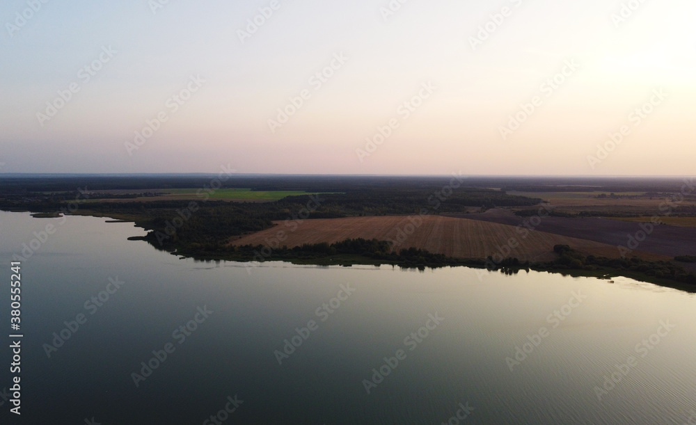 Top view of a calm large forest lake
