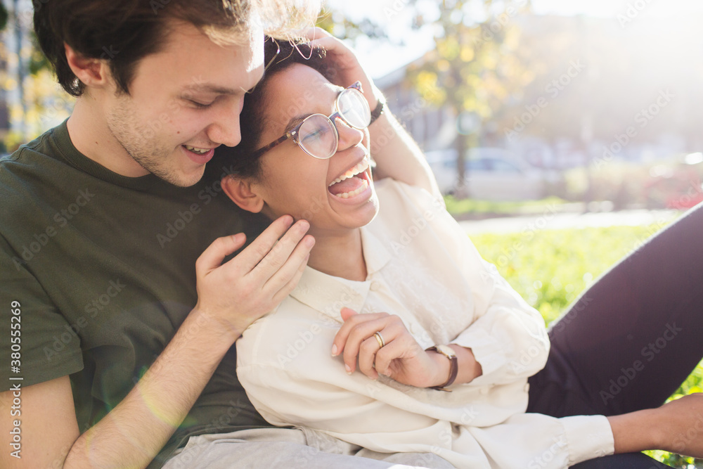 Mixed-race happy couple having fun together outdoors Mixed-race happy couple having fun together outdoors