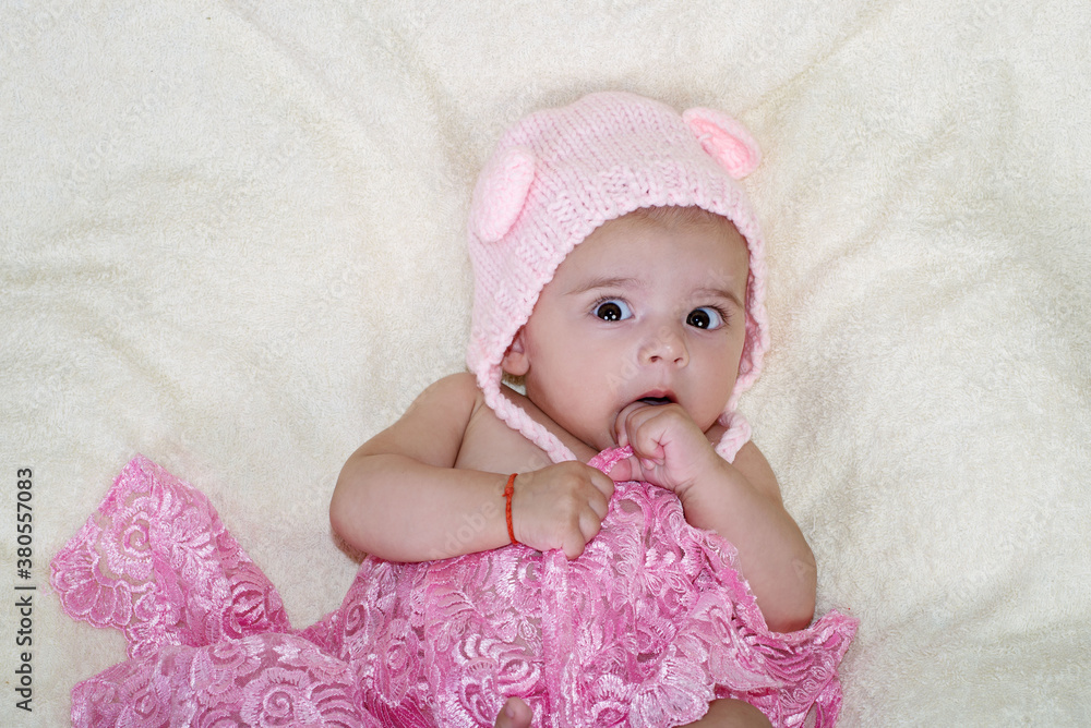 Little baby girl puts her fingers to her mouth Little baby girl puts her fingers to her mouth