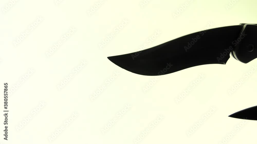 Two sharp steel knives, one ordinary second throw-out, fly by in front of the video camera. Two sharp steel knives, one ordinary second throw-out, fly by in front of the video camera.