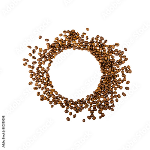 Circle frame of roasted brown coffee beans isolated on white.