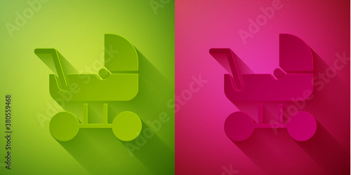 Paper cut Baby stroller icon isolated on green and pink background. Baby carriage, buggy, pram, stroller, wheel. Paper art style. Vector.
