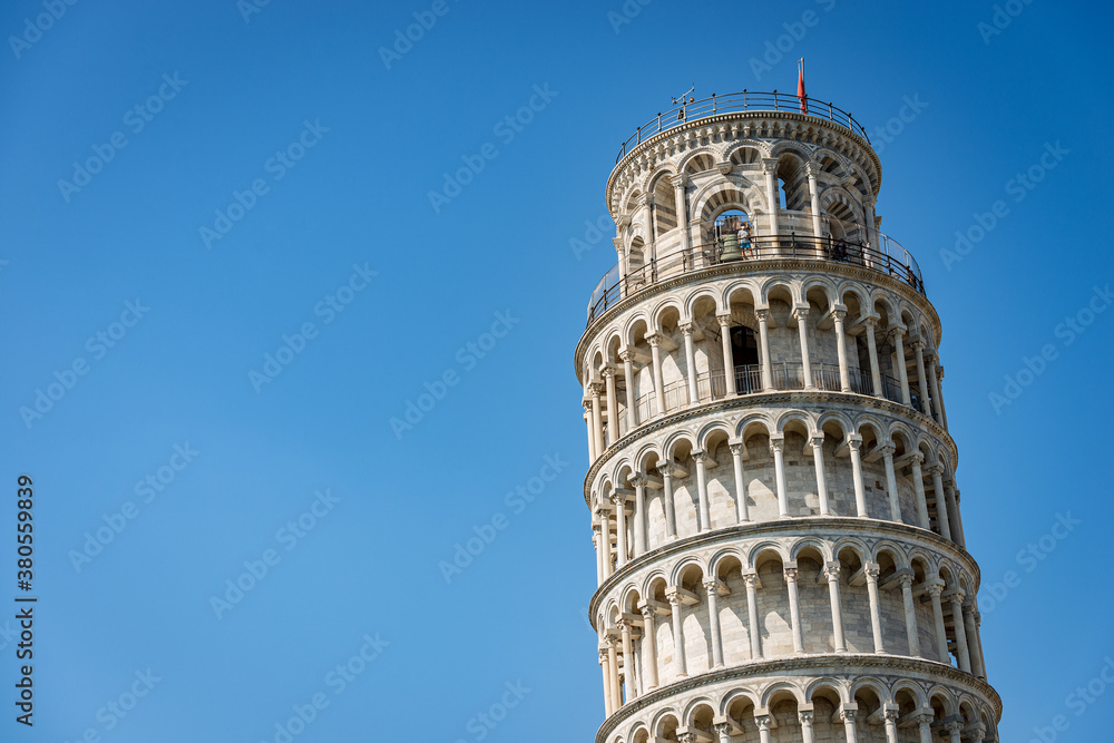 Leaning Tower of Pisa on clear blue sky, Romanesque style. (1173 - XIV Century). Piazza dei Miracoli (Square of Miracles) UNESCO world heritage site, Tuscany, Italy, Europe.