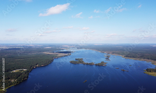 Aerial view of a beautiful calm blue forest lake