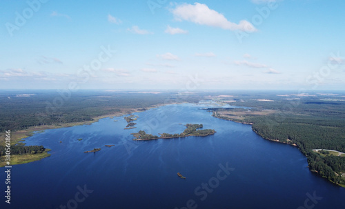 Aerial view of a beautiful calm blue forest lake