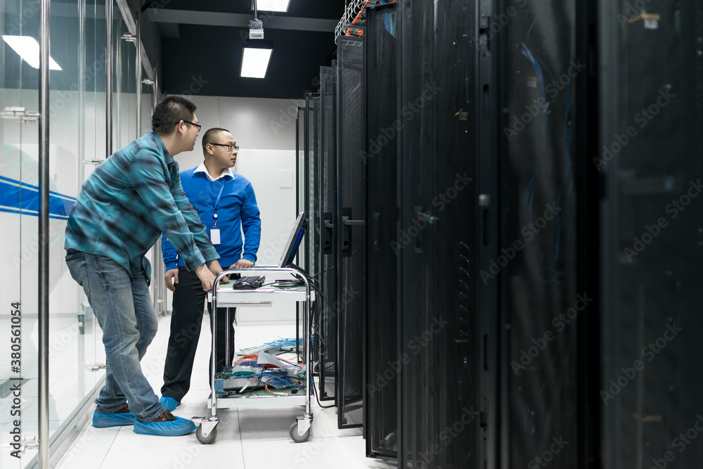 Young engineer working in datacenter Young engineer working in datacenter
