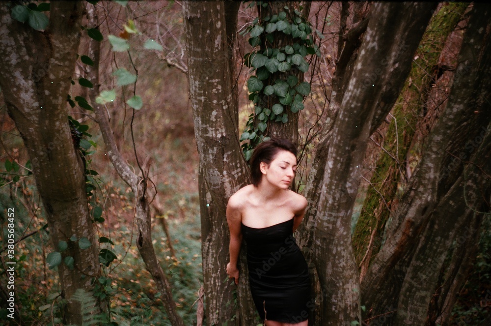 A film portrait of a young beautiful woman in the forest A film portrait of a young beautiful woman in the forest