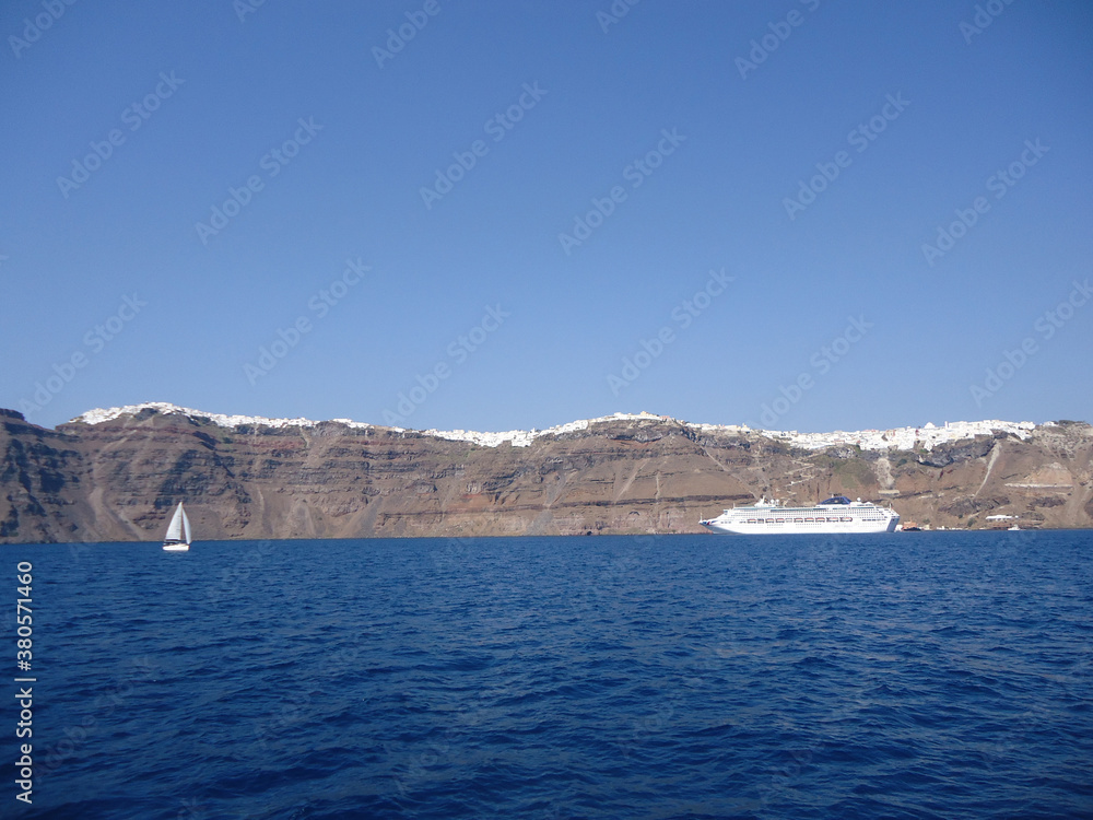 Santorini is one of the Cyclades islands in the Aegean Sea. It was devastated by a volcanic eruption in the 16th century BC, forever shaping its rugged landscape