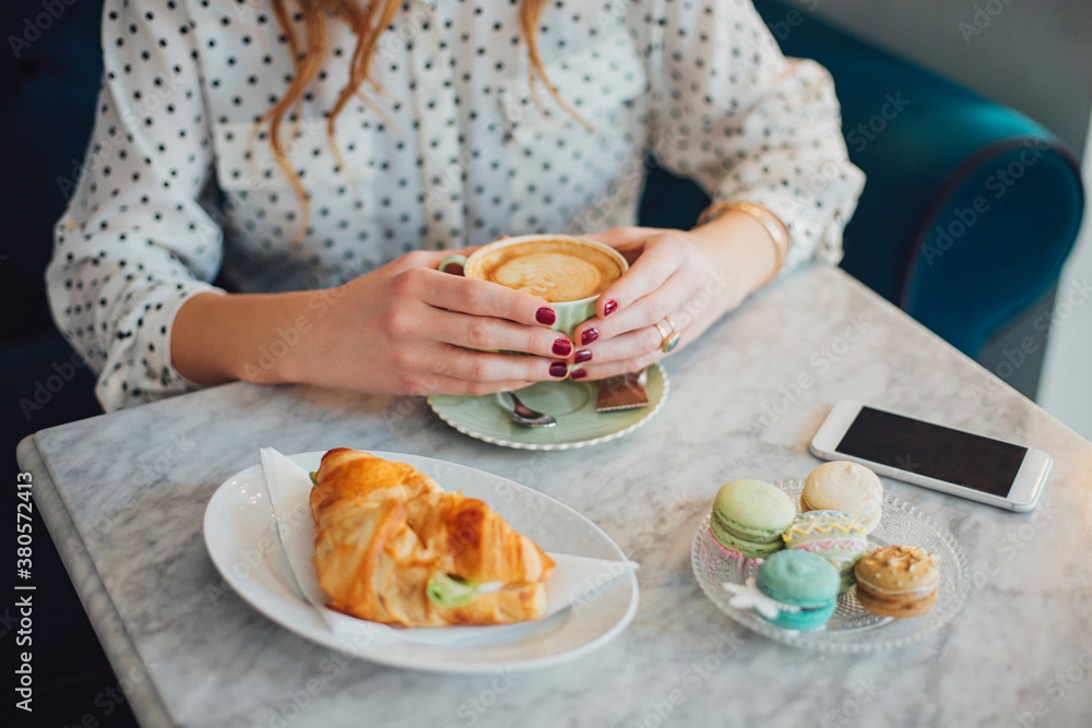 Elegant Woman Drinking Espresso at a CafÕ© Elegant Woman Drinking Espresso at a CafÕ©