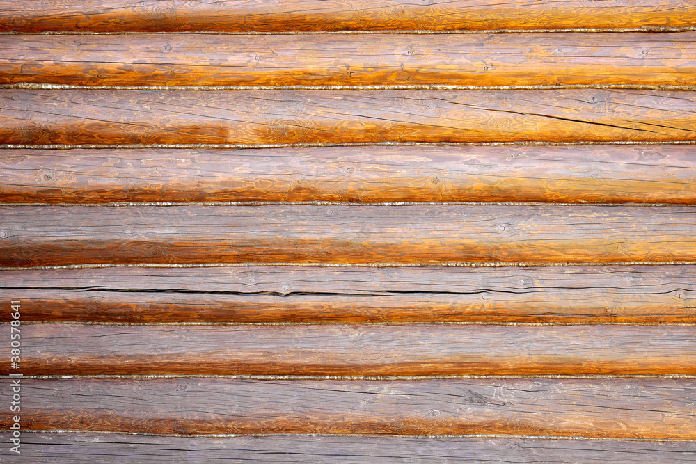 Brown wall as a background from wooden logs