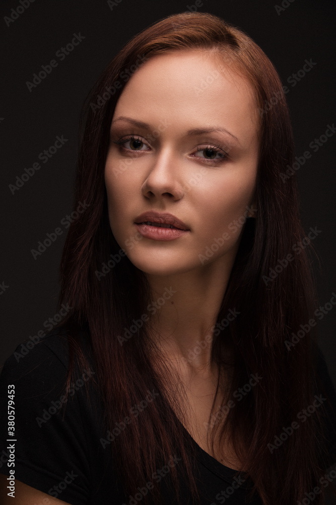 Beauty woman face portrait. Beautiful spa model girl with perfect fresh clean skin. Glitter nude makeup Youth and skin care concept. Isolated on gray background Beauty woman face portrait. Beautiful spa model girl with perfect fresh clean skin. Glitter nude makeup Youth and skin care concept. Isolated on gray background