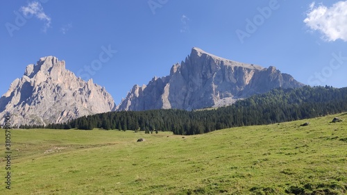 Val Gardena, Italy - 09/15/2020: Scenic alpine place with magical Dolomites mountains in background, amazing clouds and blue sky in Trentino Alto Adige region, Italy, Europe © yohananegusse