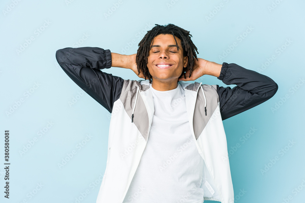 Young african american sport man feeling confident, with hands behind the head. Young african american sport man feeling confident, with hands behind the head.