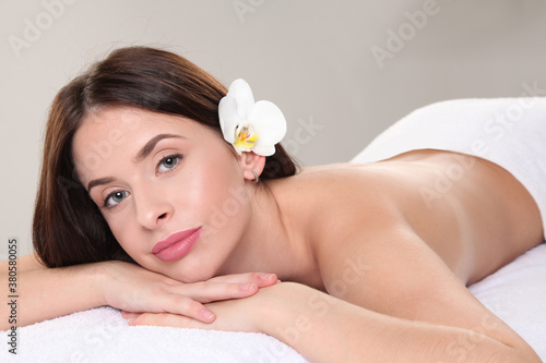 Young woman in white romantic spa center.