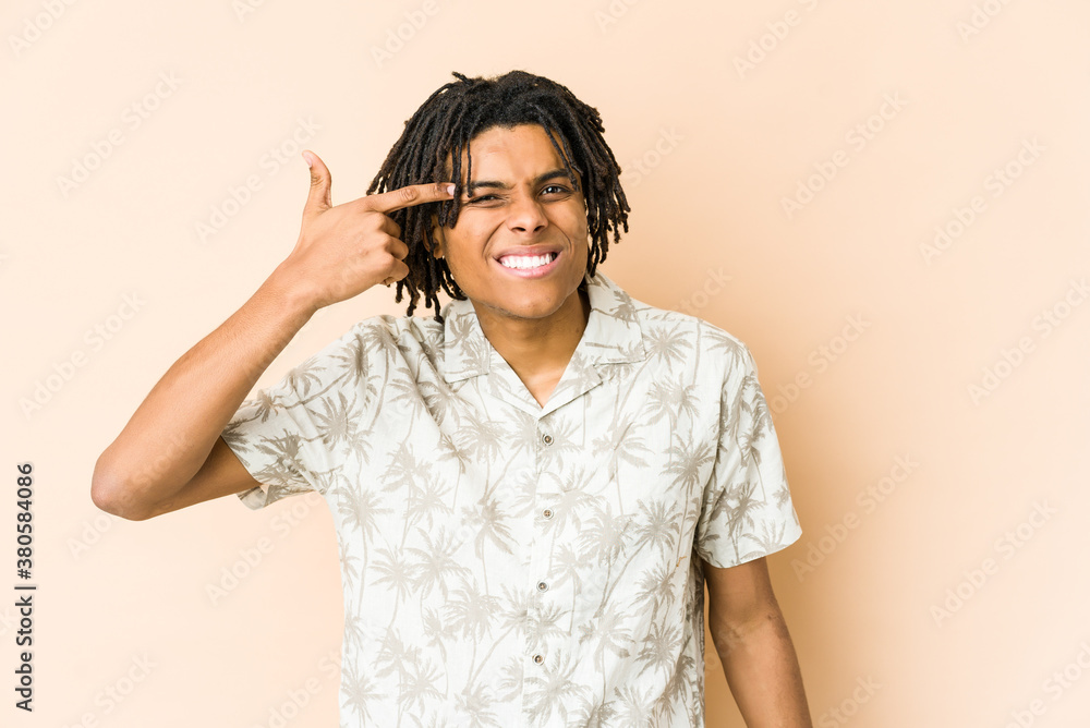Fototapeta premium Young african american rasta man showing a disappointment gesture with forefinger.
