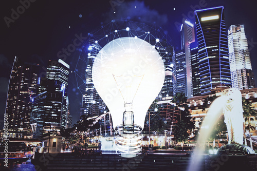 Multi exposure of bulb hologram drawing and cityscape background. Concept of idea.