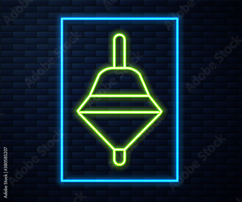 Glowing neon line Whirligig toy icon isolated on brick wall background. Vector.