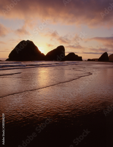 35-mmfilm image cape sebastian Oregon sunset clouds seastacks silhouettes incoming tide, reflections