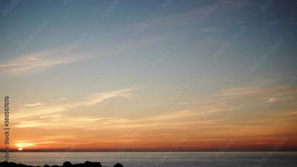 Sunrise, early morning. Sun rising over sea water surface, Spain. Time lapse Sunrise, early morning. Sun rising over sea water surface, Spain. Time lapse