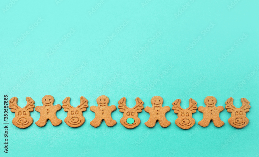 Traditional christmas homemade gingerbread cookies on paper blue mint background. Traditional christmas homemade gingerbread cookies on paper blue mint background.