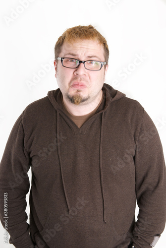 Man with glasses and brown sweatshirt