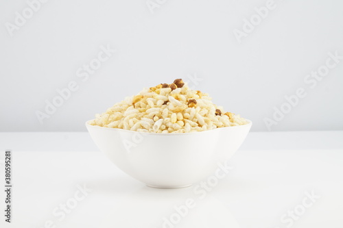 Jhalmuri is a popular Bengali street snack, made of puffed rice and an assortment of spices, vegetables, chanachur and mustard oil