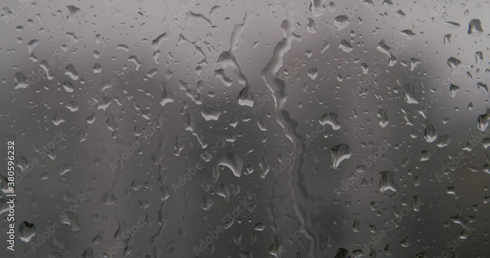real rain drops sliding on window glass real rain drops sliding on window glass
