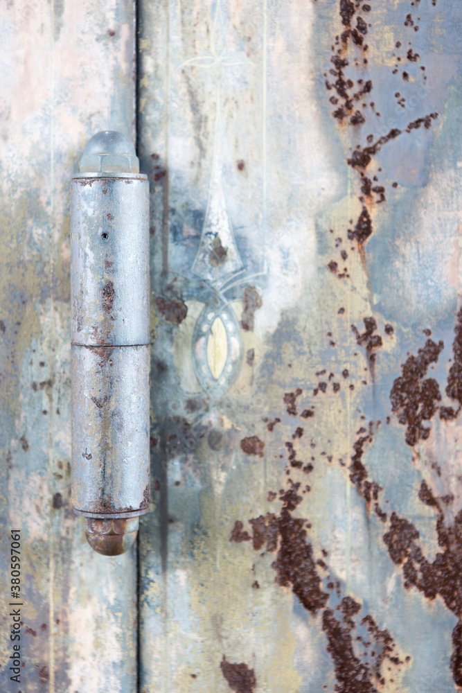 Closeup of a metal rusted door hinge on a safe Closeup of a metal rusted door hinge on a safe