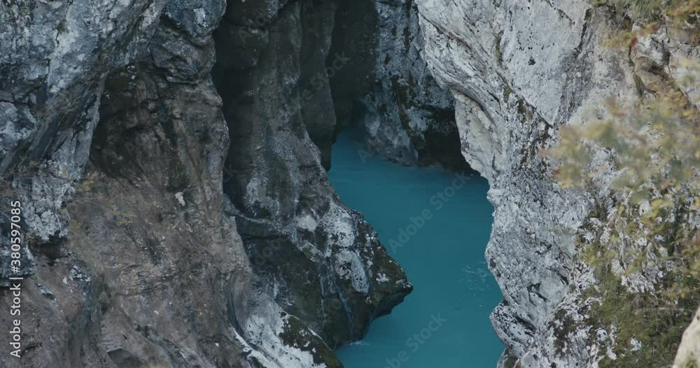 Wild river riverbed beautiful stream of pure clear water flow in gorge or canyon rocks Soča in the protected mountains of Alps Wild river riverbed beautiful stream of pure clear water flow in gorge or canyon rocks Soča in the protected mountains of Alps