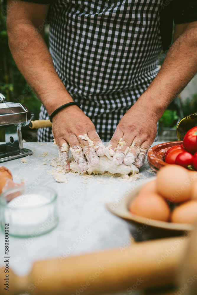 Man making fresh pasta with organic ingredients. Man making fresh pasta with organic ingredients.