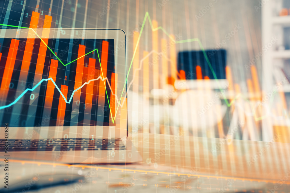 Stock market graph on background with desk and personal computer. Double exposure. Concept of financial analysis. Stock market graph on background with desk and personal computer. Double exposure. Concept of financial analysis.